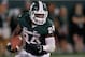 EAST LANSING, MI - AUGUST 31: Le'Veon Bell #24 of the Michigan State Spartans looks for running room during a third quarter run while playing the Boise State Broncos at Spartan Stadium on August, 2010 in East Lansing, Michigan. (Photo by Gregory Shamus/Getty Images)