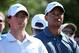 ABU DHABI, UNITED ARAB EMIRATES - JANUARY 18: and Tiger Woods of the USA (R) and Rory McIlroy of Northern Ireland (L) look on during the second round of The Abu Dhabi HSBC Golf Championship at Abu Dhabi Golf Club on January 18, 2013 in Abu Dhabi, United Arab Emirates. (Photo by Andrew Redington/Getty Images)