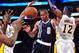 January 27, 2013; Los Angeles, CA, USA; Oklahoma City Thunder point guard Russell Westbrook (0) turns the ball over against the defense of Los Angeles Lakers small forward Metta World Peace (15) and center Dwight Howard (12) during the first half at Staples Center. Mandatory Credit: Gary A. Vasquez-USA TODAY Sports