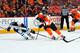 PHILADELPHIA, PA - FEBRUARY 23: Center Bryan Little #18 of the Winnipeg Jets chases the puck against Right Wing Jakub Voracek #93 of the Philadelphia Flyers on February 23, 2013 at the Wells Fargo Center in Philadelphia, Pennsylvania. (Photo by Jesse D. Garrabrant/Getty Images)