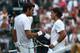 LONDON, ENGLAND - JUNE 27: Rafael Nadal of Spain (R) shakes hands with Juan Martin Del Potro of Argentina after winning his fourth round match on Day Seven of the Wimbledon Lawn Tennis Championships at the All England Lawn Tennis and Croquet Club on June 27, 2011 in London, England. (Photo by Clive Brunskill/Getty Images)