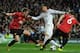 MADRID, SPAIN - FEBRUARY 13: Cristiano Ronaldo of Real Madrid is put under pressure by Jonny Evans and Phil Jones of Manchester United during the UEFA Champions League Round of 16 first leg match between Real Madrid and Manchester United at Estadio Santiago Bernabeu on February 13, 2013 in Madrid, Spain. (Photo by Gonzalo Arroyo Moreno/Getty Images)