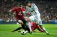 MADRID, SPAIN - FEBRUARY 13: Raphael Varane (R) of Real Madrid duels for the ball with Rafael (L) of Manchester United during the UEFA Champions League Round of 16 first leg match between Real Madrid and Manchester United at Estadio Santiago Bernabeu on February 13, 2013 in Madrid, Spain. (Photo by Jasper Juinen/Getty Images)