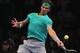 Rafael Nadal punishing a forehand.