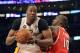 Mar 3, 2013; Los Angeles, CA, USA; Los Angeles Lakers center Dwight Howard (12) drives against Atlanta Hawks center Johan Petro (10) during the game at the Staples Center. Mandatory Credit: Richard Mackson-USA TODAY Sports