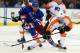 NEW YORK, NY - JANUARY 29: Marian Gaborik #10 of the New York Rangers and Claude Giroux #28 of the Philadelphia Flyers fight for the puck on January 29, 2013 at Madison Square Garden in New York City. The New York Rangers defeated the Philadelphia Flyers 2-1. (Photo by Elsa/Getty Images)