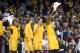 Feb 26, 2013; Minneapolis, MN, USA; Led by Minnesota Gophers forward Trevor Mbakwe (32) the bench cheers during the game against the Indiana Hoosiers at Williams Arena. The Gophers defeated number one ranked Hoosiers 77-73. Mandatory Credit: Marilyn Indahl-USA TODAY Sports