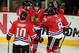 CHICAGO, IL - FEBRUARY 25: Patrick Sharp #10, Viktor Stalberg #25, Marcus Kruger #16 and Nick Leddy #8 of the Chicago Blackhawks celebrate with Patrick Kane #88 (center) after Kane's first period goal against the Edmonton Oilers at the United Center on February 25, 2013 in Chicago, Illinois. (Photo by Jonathan Daniel/Getty Images)