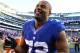 EAST RUTHERFORD, NJ - DECEMBER 30: Osi Umenyiora #72 of the New York Giants waves to the crowd after a 42-7 win against the Philadelphia Eagles at MetLife Stadium on December 30, 2012 in East Rutherford, New Jersey. (Photo by Al Bello/Getty Images)