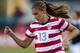 JACKSONVILLE, FL - FEBRUARY 09: Forward Alex Morgan #13 of the United States drives to the goal during the game against Scotland at EverBank Field on February 9, 2013 in Jacksonville, Florida. The United States defeated Scotland 4-1. (Photo by Michael Chang/Getty Images)