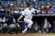 Mark Teixeira lines a hit against Detroit in Game Two of the ALCS, Oct. 14.