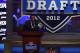 NEW YORK, NY - APRIL 26: Calvin Johnson of the Detroit Lions and 2013 EA Sports Madden Football cover player announces the Lions pick during the 2012 NFL Draft at Radio City Music Hall on April 26, 2012 in New York City. (Photo by Chris Chambers/Getty Images)