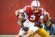 LINCOLN, NE - NOVEMBER 17: Quarterback Taylor Martinez #3 of the Nebraska Cornhuskers tries to slip the grip of linebacker James Manuel #9 of the Minnesota Golden Gophers during their game at Memorial Stadium on November 17, 2012 in Lincoln, Nebraska. Nebraska won 38-14. (Photo by Eric Francis/Getty Images)