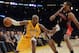 Mar 8, 2013; Los Angeles, CA, USA; Los Angeles Lakers shooting guard Kobe Bryant (24) moves the ball against Toronto Raptors shooting guard Alan Anderson (6) during the game at the Staples Center. Mandatory Credit: Richard Mackson-USA TODAY Sports