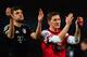 LONDON, ENGLAND - FEBRUARY 19: Thomas Mueller and Bastian Schweinsteiger of Bayern Muenchen applaud the fans after the UEFA Champions League round of 16 first leg match between Arsenal and Bayern Muenchen at Emirates Stadium on February 19, 2013 in London, England. (Photo by Shaun Botterill/Getty Images)