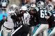 CHARLOTTE, NC - DECEMBER 23: Referee Jerome Boger tries to stop a fight as Tommy Kelly #93 of the Oakland Raiders pushes forward during their game against the Carolina Panthers at Bank of America Stadium on December 23, 2012 in Charlotte, North Carolina. (Photo by Streeter Lecka/Getty Images)