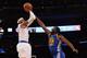 NEW YORK, NY - FEBRUARY 27: Carmelo Anthony #7 of the New York Knicks shoots past Draymond Green #23 of the Golden State Warriors at Madison Square Garden on February 27, 2013 in New York City. NOTE TO USER: User expressly acknowledges and agrees that, by downloading and/or using this photograph, user is consenting to the terms and conditions of the Getty Images License Agreement. The Knicks defeated the Warriors 109-105. (Photo by Bruce Bennett/Getty Images)