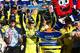 Matt Kenesth celebrates with the No. 20 team in Las Vegas victory lane. Credit: David Yeazell