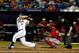 PORT ST. LUCIE, FL - FEBRUARY 25: David Wright #5 of the New York Mets at bat as Carlos Maldonado #49 of the Washington Nationals looks on at Tradition Field on February 25, 2013 in Port St. Lucie, Florida. (Photo by Chris Trotman/Getty Images)