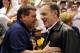Feb. 12, 2013; East Lansing, MI, USA; Michigan Wolverines football head coach Brady Hoke and Michigan State Spartans football head coach Mark Dantonio greet each other before a basketball game at Jack Breslin Students Events Center. Mandatory Credit: Mike Carter-USA TODAY Sports