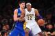 December 2, 2012; Los Angeles, CA, USA; Los Angeles Lakers center Dwight Howard (12) controls the ball against the defense of Orlando Magic center Nikola Vucevic (9) during the first half at Staples Center. Mandatory Credit: Gary A. Vasquez-USA TODAY Sports