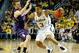 ANN ARBOR, MI - JANUARY 30: Trey Burke #3 of the Michigan Wolverines drives around Alex Marcotullio #4 of the Northwestern Wildcats during the first half at Crisler Center on January 30, 2013 in Ann Arbor, Michigan. (Photo by Gregory Shamus/Getty Images)