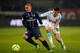 PARIS, FRANCE - FEBRUARY 24: Marco Verratti of PSG and Joey Barton of Marseille battle for the ball during the Ligue 1 match between Paris Saint-Germain FC and Olympique de Marseille at Parc des Princes on February 24, 2013 in Paris, France. (Photo by Dean Mouhtaropoulos/Getty Images)