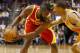 March 9, 2013; Phoenix, AZ, USA; Houston Rockets shooting guard James Harden (13) controls the ball against Phoenix Suns point guard Kendall Marshall (12) in the first half at US Airways Center. Mandatory Credit: Rick Scuteri-USA TODAY Sports