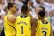 Feb. 12, 2013; East Lansing, MI, USA; Michigan Wolverines forward Mitch McGary (4) and forward Glenn Robinson III (1) and guard Trey Burke (3) and guard Nik Stauskas (11) meet on court during the second half against the Michigan State Spartans at Jack Breslin Students Events Center. Mandatory Credit: Mike Carter-USA TODAY Sports