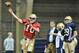 Notre Dame quarterback wearing red no contact jersey during practice