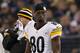 BALTIMORE, MD - DECEMBER 02: Wide receiver Plaxico Burress #80 of the Pittsburgh Steelers looks on from the sideline during the Steelers and Baltimore Ravens game at M&T Bank Stadium on December 2, 2012 in Baltimore, Maryland. (Photo by Rob Carr/Getty Images)