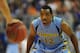 GAINESVILLE, FL - NOVEMBER 29: Guard Derrick Wilson #12 of the Marquette Golden Eagles sets on defense against the Florida Gators November 29, 2012 at Stephen C. O'Connell Center in Gainesville, Florida. (Photo by Al Messerschmidt/Getty Images)