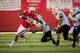 LINCOLN, NE - SEPTEMBER 22: Running back Imani Cross #32 of the Nebraska Cornhuskers runs past linebacker Demetrius Allen #11, defensive back Phillip Pleasant #24 and defensive back Donovan Henley #2 of the Idaho State Bengals during their game at Memorial Stadium on September 22, 2012 in Lincoln, Nebraska. (Photo by Eric Francis/Getty Images)