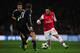 LONDON, ENGLAND - FEBRUARY 19: Santi Cazorla of Arsenal in action against Philipp Lahm of Bayern Muenchen during the UEFA Champions League round of 16 first leg match between Arsenal and Bayern Muenchen at Emirates Stadium on February 19, 2013 in London, England. (Photo by Shaun Botterill/Getty Images)