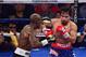 Jun. 9, 2012; Las Vegas, NV, USA; Manny Pacquiao (right) against Timothy Bradley Jr during a welterweight championship bout at the MGM Grand Garden Arena. Mandatory Credit: Mark J. Rebilas-USA TODAY Sports