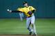 FORT MYERS, FL - MARCH 01: Infielder Neil Walker #18 of the Pittsburgh Pirates throws over to first for an out against the Boston Red Sox during a Grapefruit League Spring Training Game at JetBlue Park on March 1, 2013 in Fort Myers, Florida. (Photo by J. Meric/Getty Images)