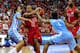 RALEIGH, NC - JANUARY 26: Lorenzo Brown #2 of the North Carolina State Wolfpack drives between Marcus Paige #5 and Dexter Strickland #1 of the North Carolina Tar Heels during play at PNC Arena on January 26, 2013 in Raleigh, North Carolina. (Photo by Grant Halverson/Getty Images)