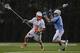 Mar 2, 2012; Princeton, NJ, USA; Princeton Tigers defender John Cunningham (3) works against John Hopkins Blue Jays defender Jack Reilly (43) at Princeton. Mandatory Credit: Jim O'Connor-USA TODAY Sports