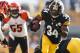 PITTSBURGH, PA - DECEMBER 23: Rashard Mendenhall #34 of the Pittsburgh Steelers looks for running room while playing the Cincinnati Bengals during a second quarter run at Heinz Field on December 23, 2012 in Pittsburgh, Pennsylvania. (Photo by Gregory Shamus/Getty Images)