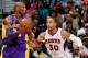 ATLANTA, GA - MARCH 13: Dahntay Jones #30 of the Atlanta Hawks defends against Kobe Bryant #24 of the Los Angeles Lakers at Philips Arena on March 13, 2013 in Atlanta, Georgia. NOTE TO USER: User expressly acknowledges and agrees that, by downloading and or using this photograph, User is consenting to the terms and conditions of the Getty Images License Agreement. (Photo by Kevin C. Cox/Getty Images)