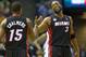 Dec 29, 2012; Milwaukee, WI, USA; Miami Heat guard Dwyane Wade (3) (right) celebrates a play with forward Tobias Harris (15) during the third quarter against the Milwaukee Bucks at the BMO Harris Bradley Center. Mandatory Credit: Jeff Hanisch-USA TODAY Sports