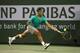 INDIAN WELLS, CA - MARCH 13: Rafael Nadal of Spain hits a return to Ernests Gulbis of Latvia during day 8 of the BNP Paribas Open at Indian Wells Tennis Garden on March 13, 2013 in Indian Wells, California. Nadal won 4-6, 6-4, 7-5. (Photo by Stephen Dunn/Getty Images)