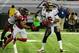 ATLANTA, GA - DECEMBER 30: Josh Freeman #5 of the Tampa Bay Buccaneers passes despite pressure by John Abraham #55 of the Atlanta Falcons at the Georgia Dome on December 30, 2012 in Atlanta, Georgia (Photo by Scott Cunningham/Getty Images)