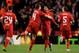 LIVERPOOL, ENGLAND - FEBRUARY 21: Luis Suarez (2nd R) of Liverpool celebrates with teammate Jordan Henderson (2nd L) after scoring his team's third goal from a free kick during the UEFA Europa League round of 32 second leg match between Liverpool FC and FC Zenit St Petersburg at Anfield on February 21, 2013 in Liverpool, England. (Photo by Alex Livesey/Getty Images)