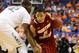 Mar 15, 2013; Greensboro, NC, USA; Boston College Eagles guard Olivier Hanlan (21) dribbles as Miami (Fl) Hurricanes center Reggie Johnson (42) defends in the first half during the quarterfinals of the ACC tournament at Greensboro Coliseum. Mandatory Credit: Bob Donnan-USA TODAY Sports