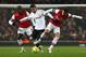 LONDON, ENGLAND - JANUARY 16: Pablo Hernandez of Swansea City takes on Bacary Sagna and Santi Cazorla of Arsenal (R) during the FA Cup with Budweiser Third Round Replay match between Arsenal and Swansea City at the Emirates Stadium on January 16, 2013 in London, England. (Photo by Jan Kruger/Getty Images)