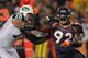 DENVER, CO - NOVEMBER 17: Defensive lineman Elvis Dumervil #92 of the Denver Broncos fights against the block of offensive tackle Wayne Hunter #78 of the New York Jets at Sports Authority Field at Mile High on November 17, 2011 in Denver, Colorado. The Broncos defeated the Jets 17-13. (Photo by Doug Pensinger/Getty Images)