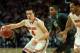 Mar 16, 2013; Chicago, IL, USA; Ohio State Buckeyes guard Aaron Craft (4) controls the ball against Michigan State Spartans guard Gary Harris (14) in the first half during the semifinals of the Big Ten tournament at the United Center. Mandatory Credit: Dennis Wierzbicki-USA TODAY Sports