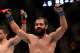 Mar 16, 2013; Montreal, Quebec, CAN; Johny Hendricks (blue) celebrates after his main card bout against Carlos Condit (red) at UFC 158 at the Bell Centre. Mandatory Credit: Eric Bolte-USA TODAY Sports