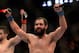 Mar 16, 2013; Montreal, Quebec, CAN; Johny Hendricks (blue) celebrates after his main card bout against Carlos Condit (red) at UFC 158 at the Bell Centre. Mandatory Credit: Eric Bolte-USA TODAY Sports